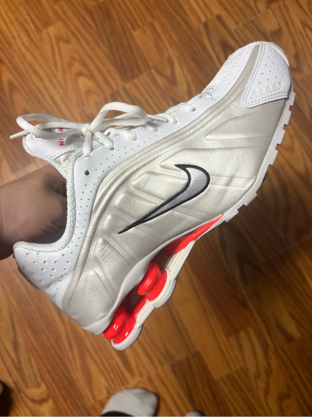Nike Women's White Sneakers with Black Swoosh and Red Pods